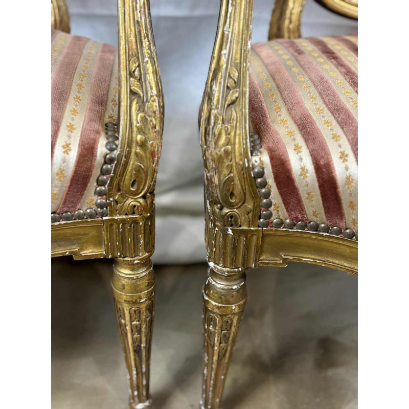 Suite of four medallion-back armchairs, carved gilt wood, 19th c