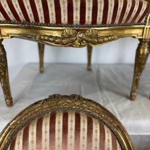 Suite of four medallion-back armchairs, carved gilt wood, 19th c