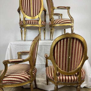 Suite of four medallion-back armchairs, carved gilt wood, 19th c