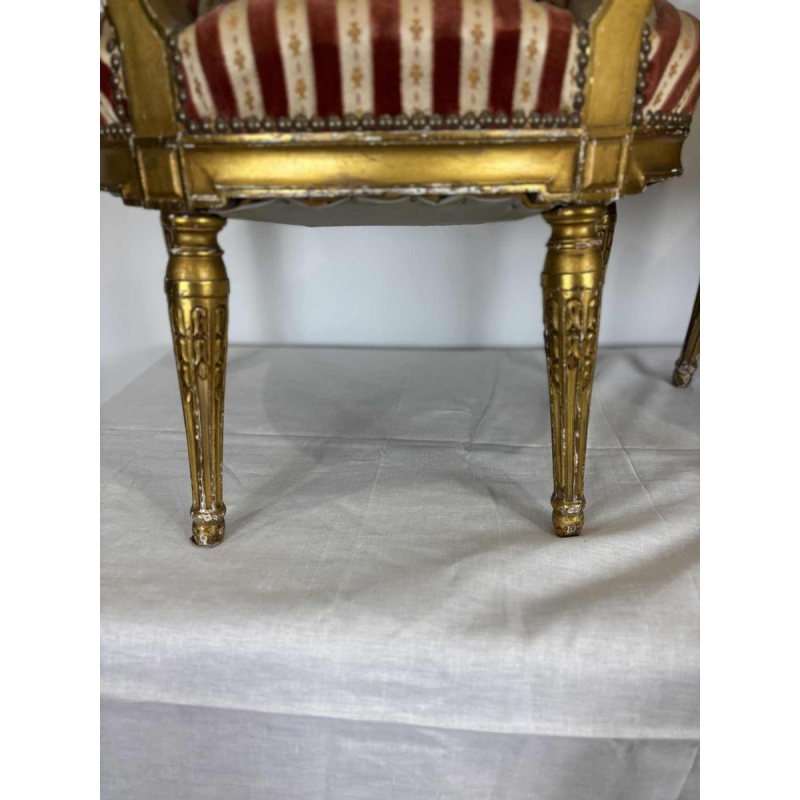 Suite of four medallion-back armchairs, carved gilt wood, 19th c