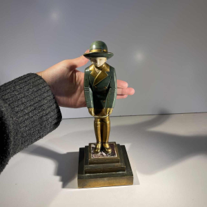 Art Deco chryselephantine sculpture 'Girl with a Basket', bronze with green and gold patina, ca 1930