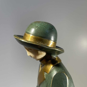 Art Deco chryselephantine sculpture 'Girl with a Basket', bronze with green and gold patina, ca 1930