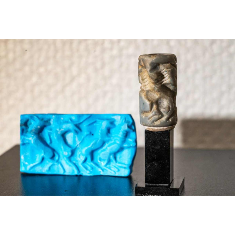 Blue-grey aragonite cylinder seal, Euphrates valley, Third Dynasty, Mesopotamia ca 2600-2334