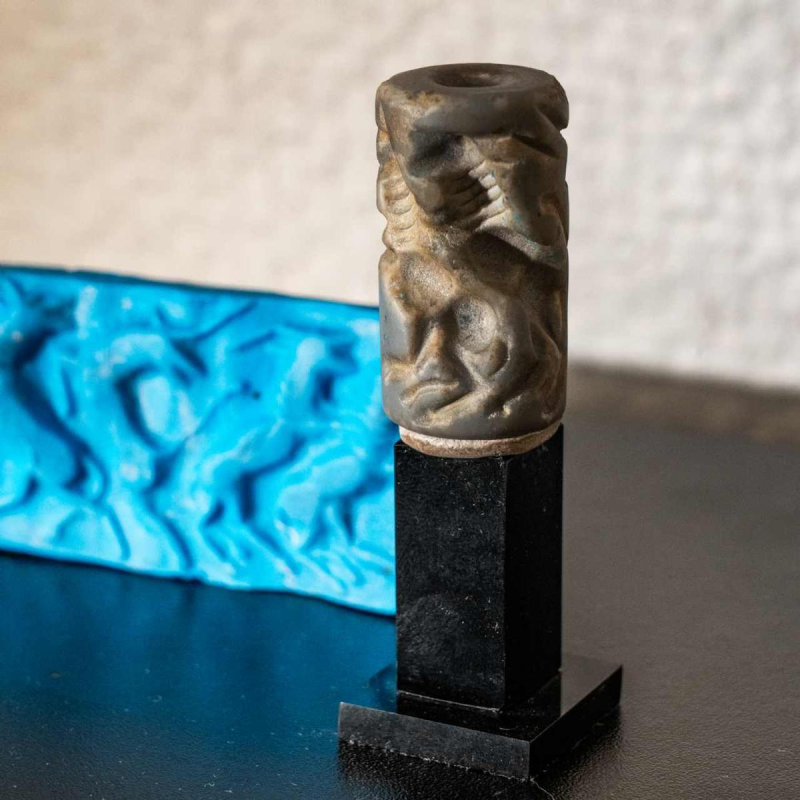 Blue-grey aragonite cylinder seal, Euphrates valley, Third Dynasty, Mesopotamia ca 2600-2334