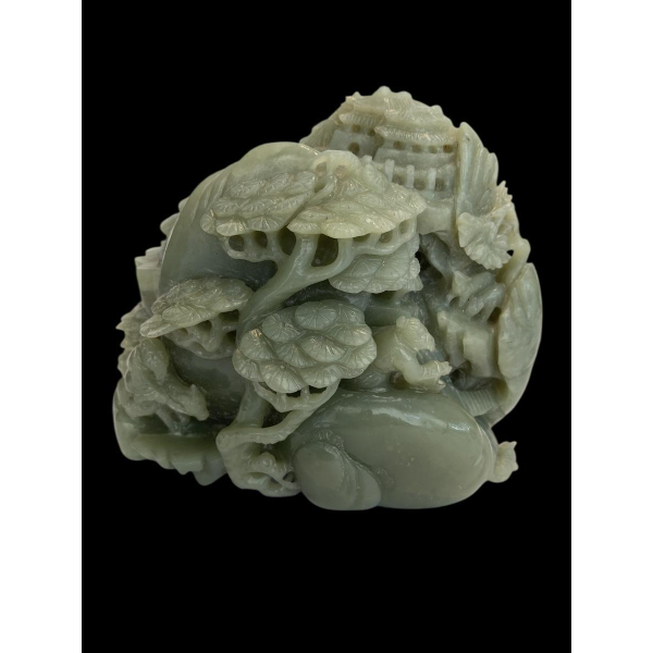 Celadon jade carved block, with trees, figures and rocks, 20th century