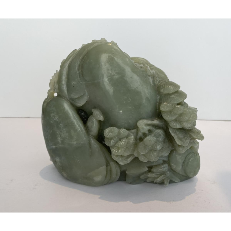 Celadon jade carved block, with trees, figures and rocks, 20th century
