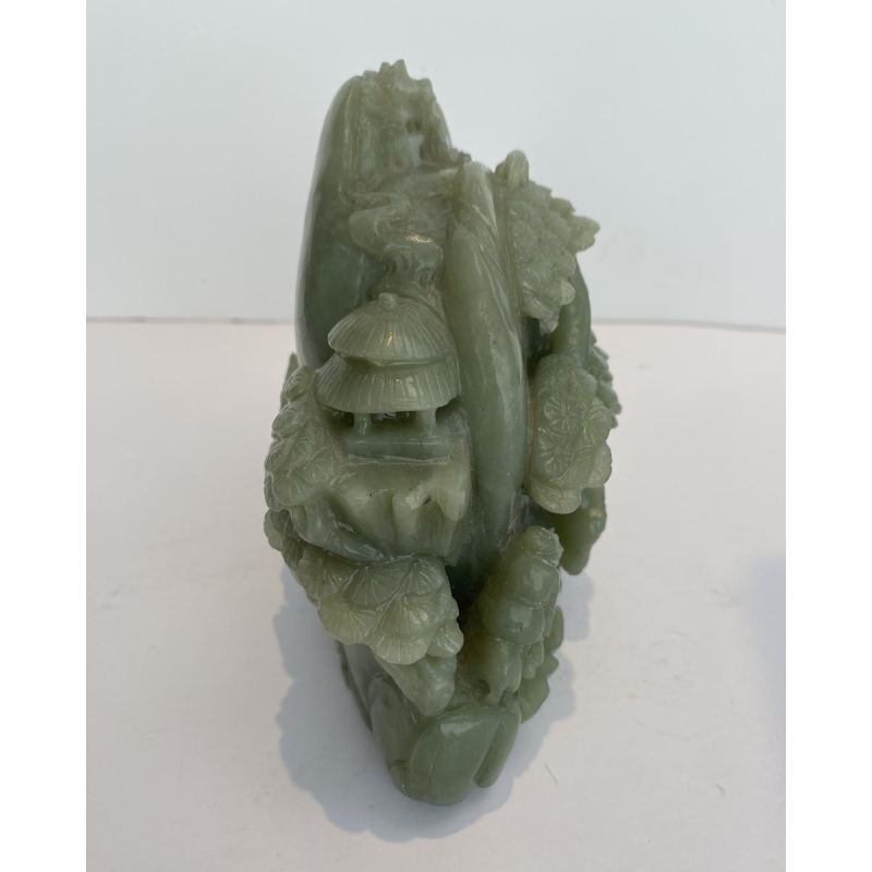 Celadon jade carved block, with trees, figures and rocks, 20th century