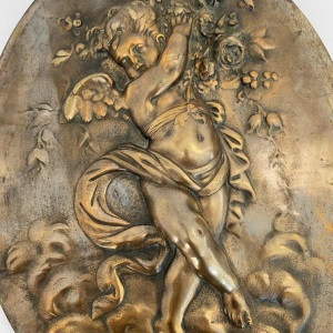 Bas-relief “Putto Carrying Flowers” romantic bronze sculpture, late 19th c