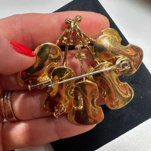 Arman, gold brooch/pendant, decorated with violins, 20th-century New Realism