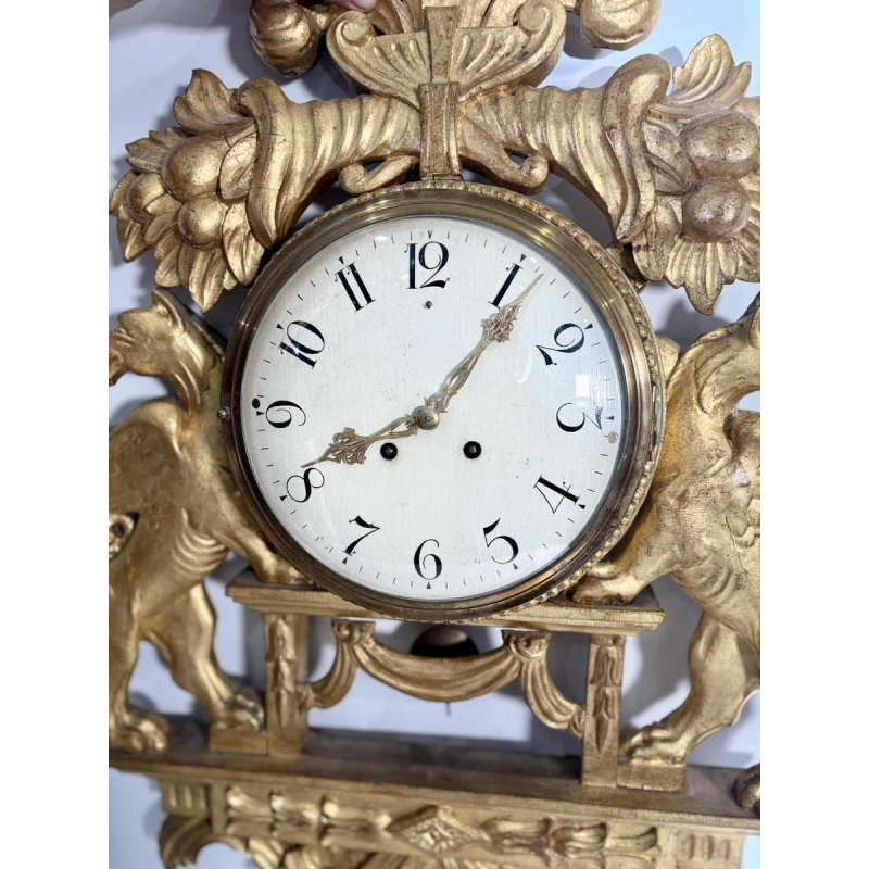 Large giltwood wall clock with winged griffins, Sweden, 19th century