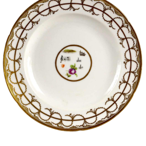 Manufacture de Nast / Porcelaine de Paris, assiette à décor de rebus, XVIIIe s