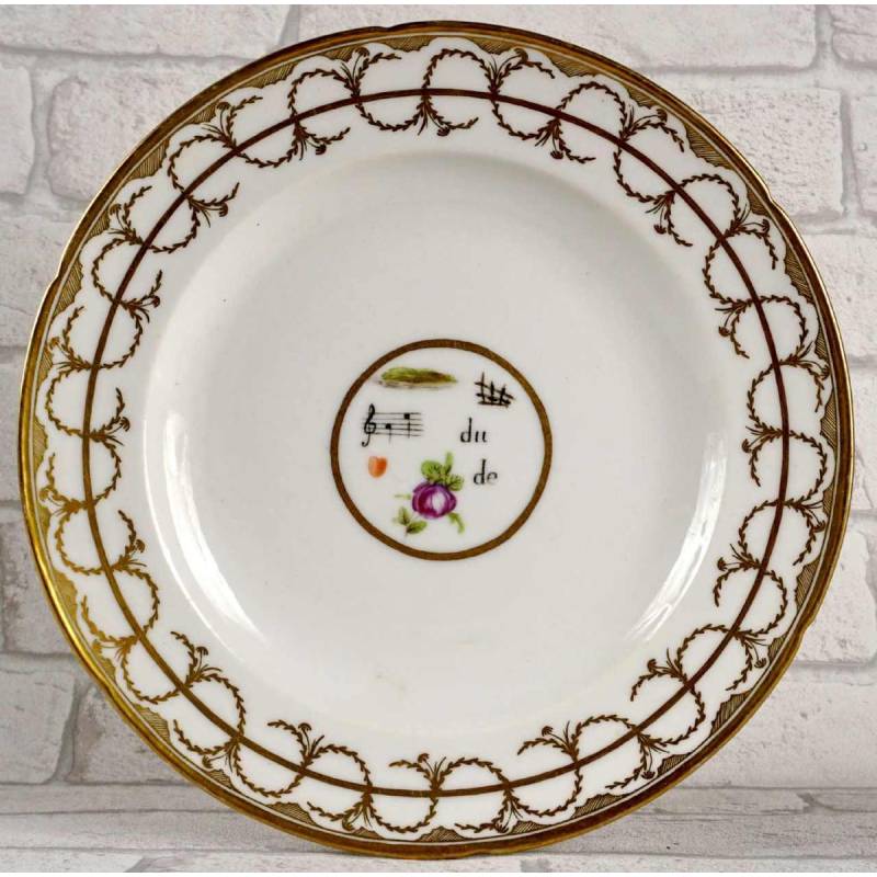 Manufacture de Nast / Porcelaine de Paris, plate decorated with scraps, 18th century