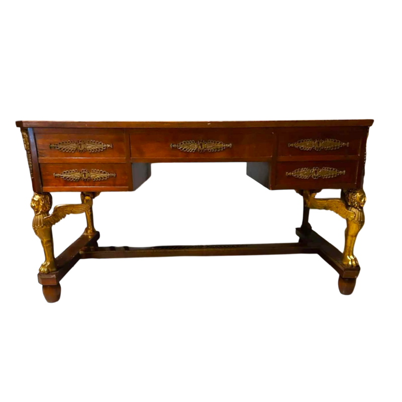 Mahogany desk supported by four winged bronze sphinxes + armchair, Empire style, 19th century