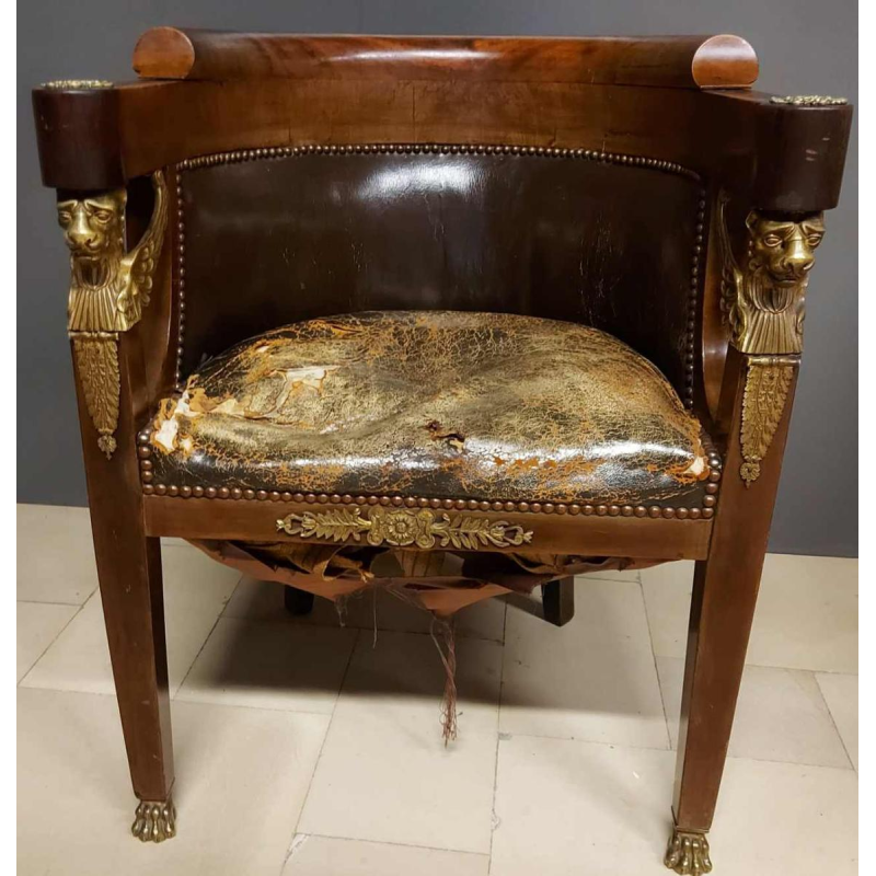 Mahogany desk supported by four winged bronze sphinxes + armchair, Empire style, 19th century