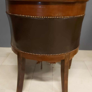 Mahogany desk supported by four winged bronze sphinxes + armchair, Empire style, 19th century