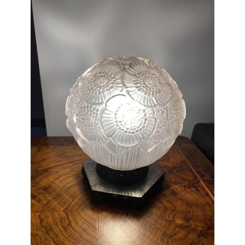 Art Deco table lamp, pressed ball glass with floral decoration, hexagonal wrought iron base, ca 1930