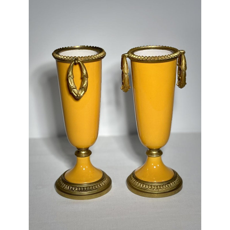 Pair of porcelain vases on pedestals, adorned with a gilt bronze mount, 19th century