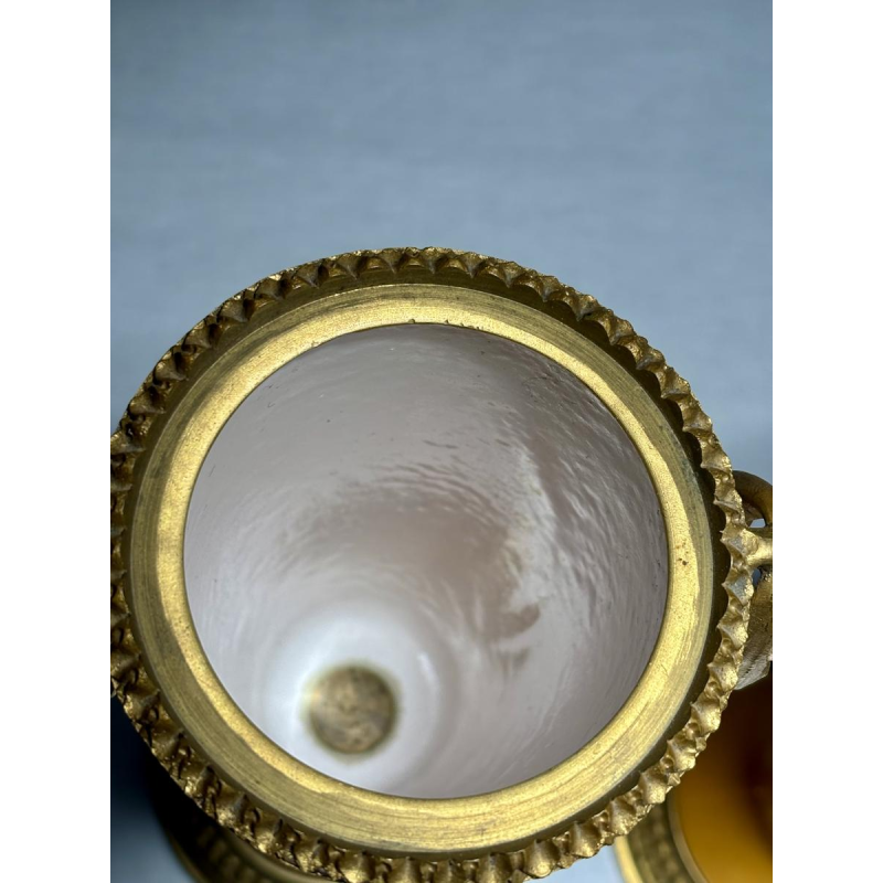 Pair of porcelain vases on pedestals, adorned with a gilt bronze mount, 19th century