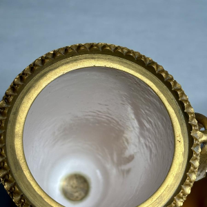 Pair of porcelain vases on pedestals, adorned with a gilt bronze mount, 19th century