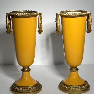 Pair of porcelain vases on pedestals, adorned with a gilt bronze mount, 19th century