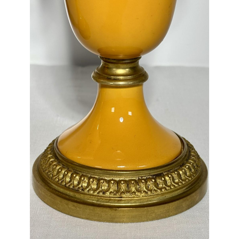 Pair of porcelain vases on pedestals, adorned with a gilt bronze mount, 19th century