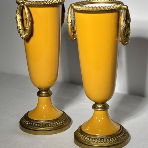 Pair of porcelain vases on pedestals, adorned with a gilt bronze mount, 19th century