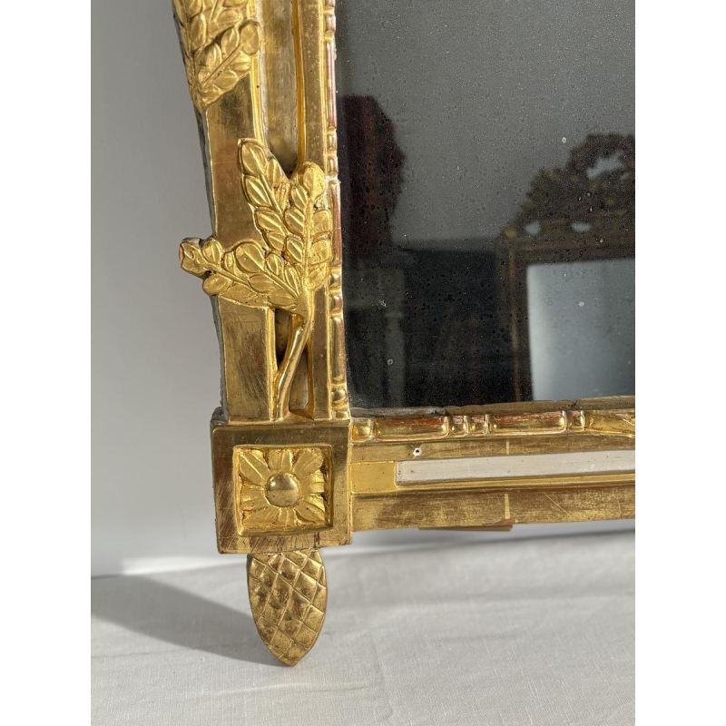Louis XVI style mirror in carved and gilded wood, with hand-painted details, 18th century