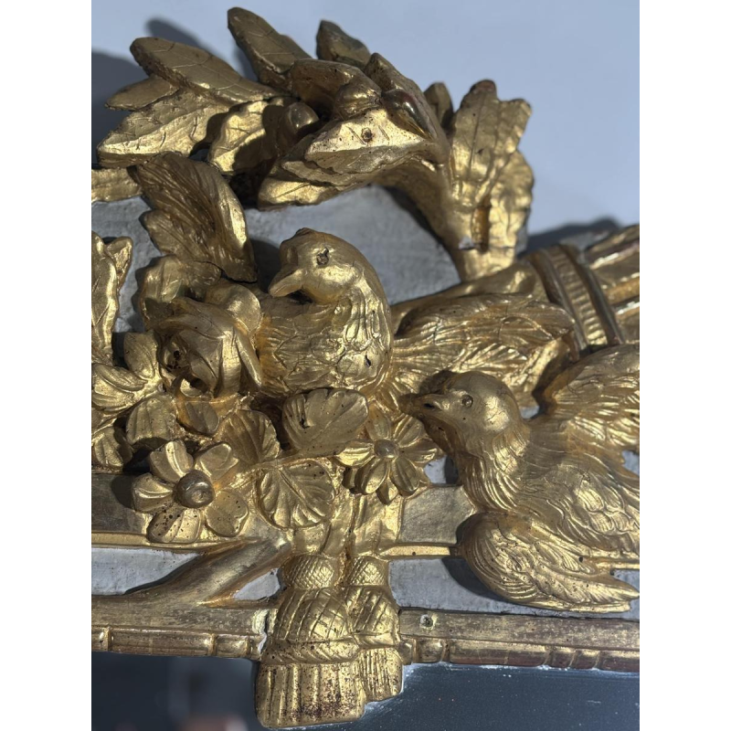 Louis XVI style mirror in carved and gilded wood, with hand-painted details, 18th century