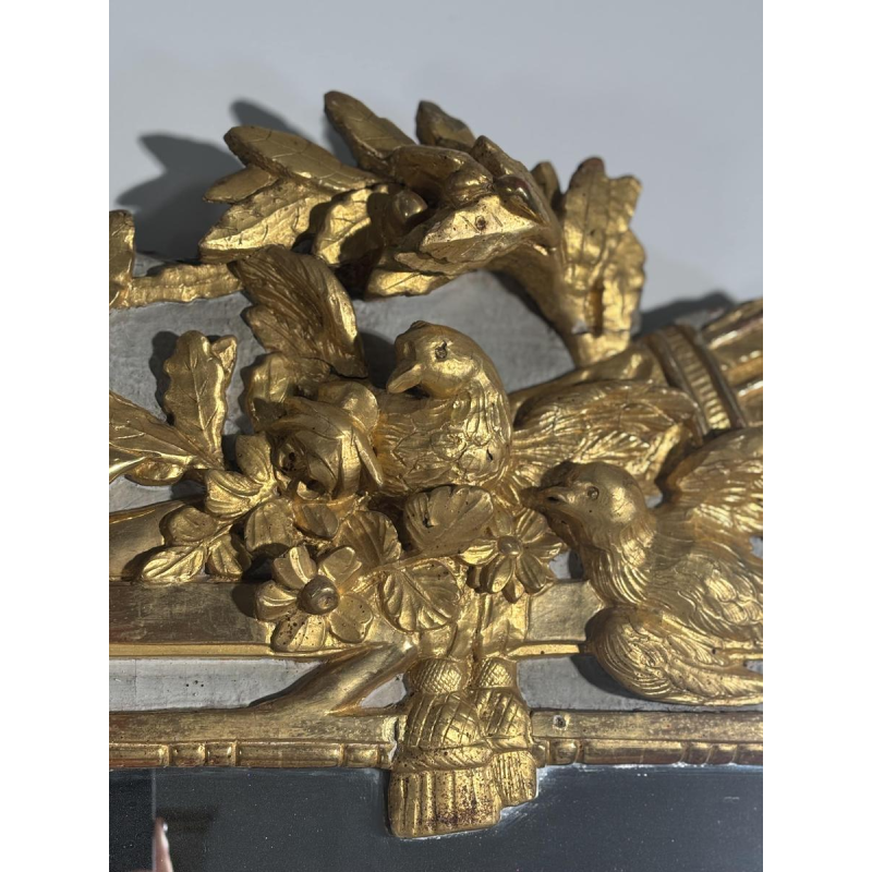 Louis XVI style mirror in carved and gilded wood, with hand-painted details, 18th century