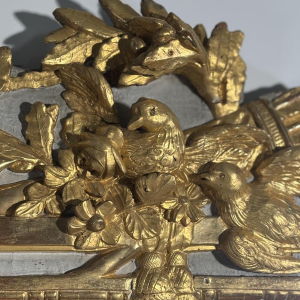Louis XVI style mirror in carved and gilded wood, with hand-painted details, 18th century