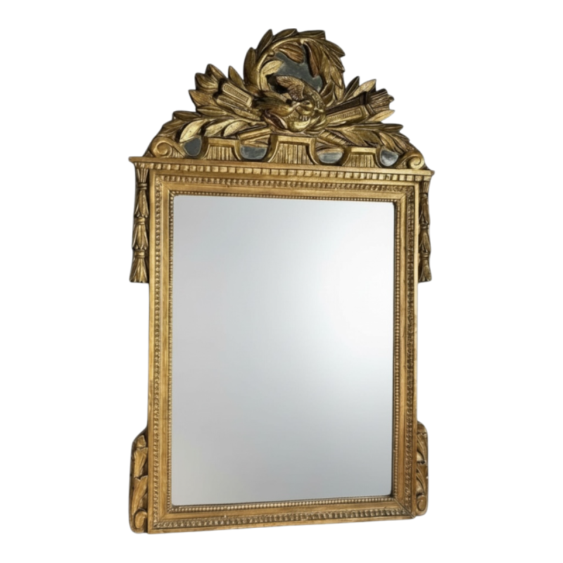 Mirror with a carved giltwood pediment, France, early 19th century