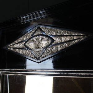 Large Art Deco mirror, wood and silver-patinated stucco, early 20th century