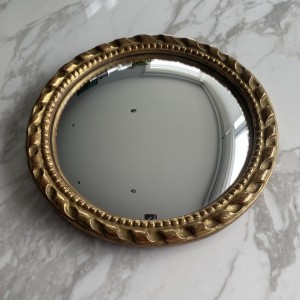 Miroir "oeil de sorcière" circulaire en bois sculpté doré