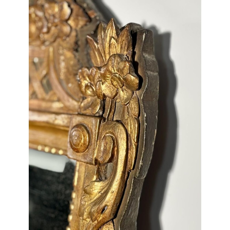 Mirror with a wooden and gilded stucco pediment - Louis XVI period - 18th century
