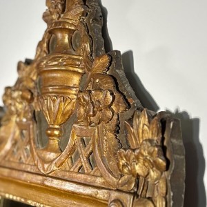 Mirror with a wooden and gilded stucco pediment - Louis XVI period - 18th century