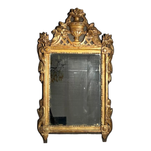 Mirror with a wooden and gilded stucco pediment - Louis XVI period - 18th century