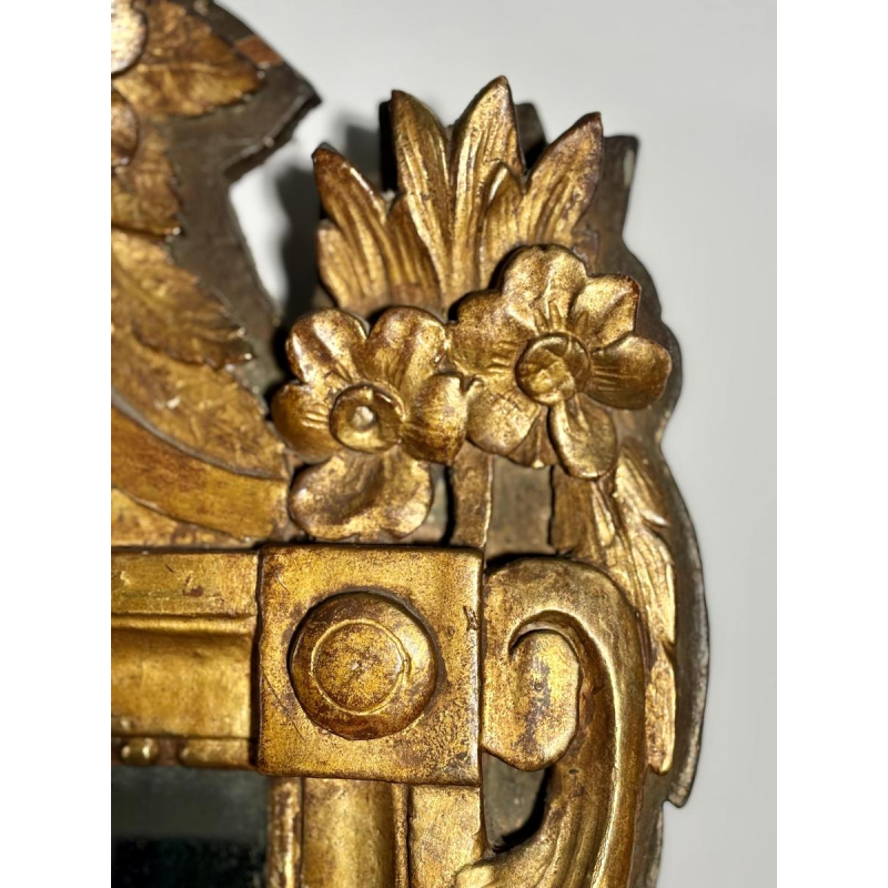 Mirror with a wooden and gilded stucco pediment - Louis XVI period - 18th century