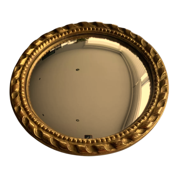 Circular "witch's eye" mirror in gilded carved wood