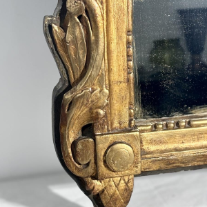 Mirror with a wooden and gilded stucco pediment - Louis XVI period - 18th century