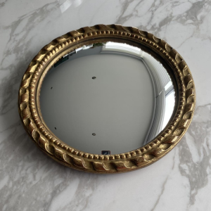 Miroir "oeil de sorcière" circulaire en bois sculpté doré