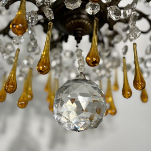 Eight-light chandelier with pendants, in bronze and crystal, amber glass drops, circa 1900