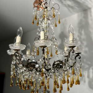 Eight-light chandelier with pendants, in bronze and crystal, amber glass drops, circa 1900