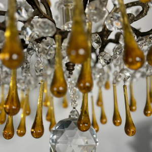 Eight-light chandelier with pendants, in bronze and crystal, amber glass drops, circa 1900