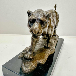 Sculpture of a lioness in bronze signed Barye (post-mortem casting)