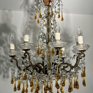 Eight-light chandelier with pendants, in bronze and crystal, amber glass drops, circa 1900