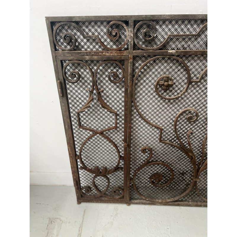 Hammered wrought iron gate, decorated with scrolls, flowers and foliage, 20th century