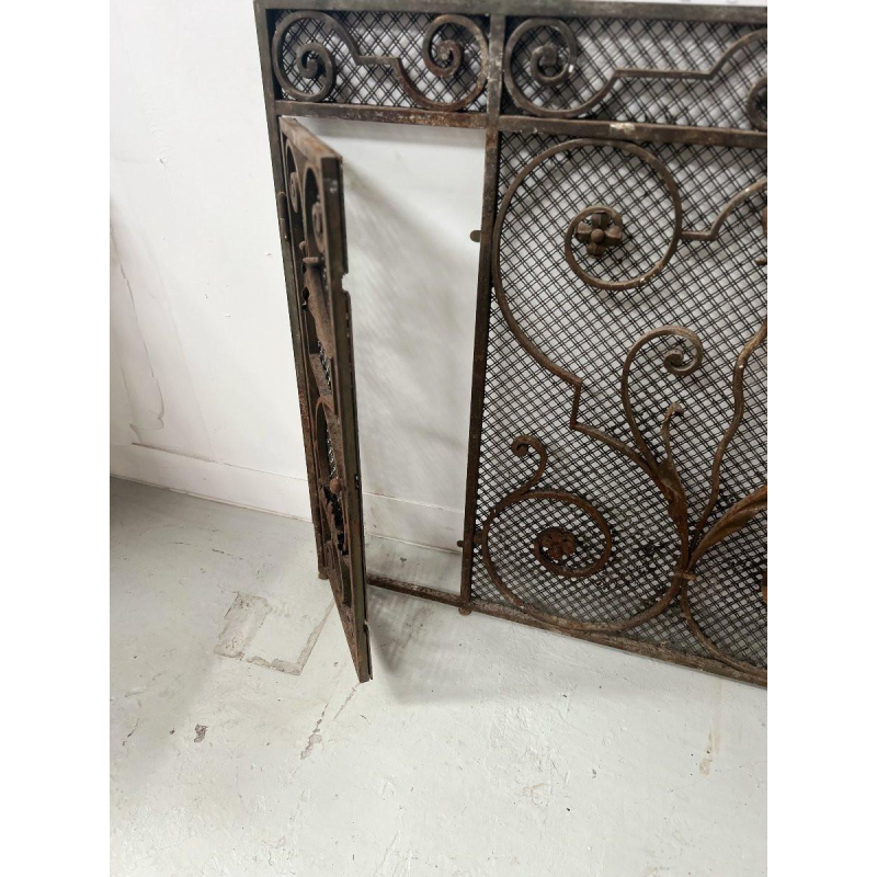 Hammered wrought iron gate, decorated with scrolls, flowers and foliage, 20th century