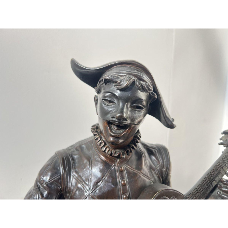 Marcel Debut "The Musician Harlequin" bronze sculpture with brown patina, ca. 1900