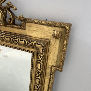 Miroir de style Louis XVI en bois et stuc doré, XIXe siècle