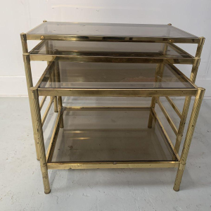 Set of three vintage nesting tables in brass and smoked glass, 20th century